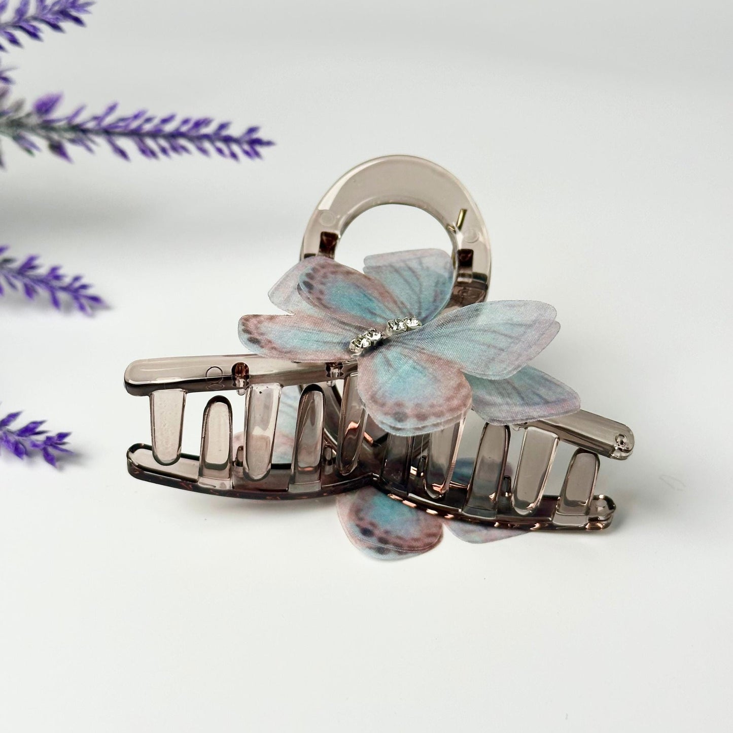 a couple of hair clips sitting on top of a table