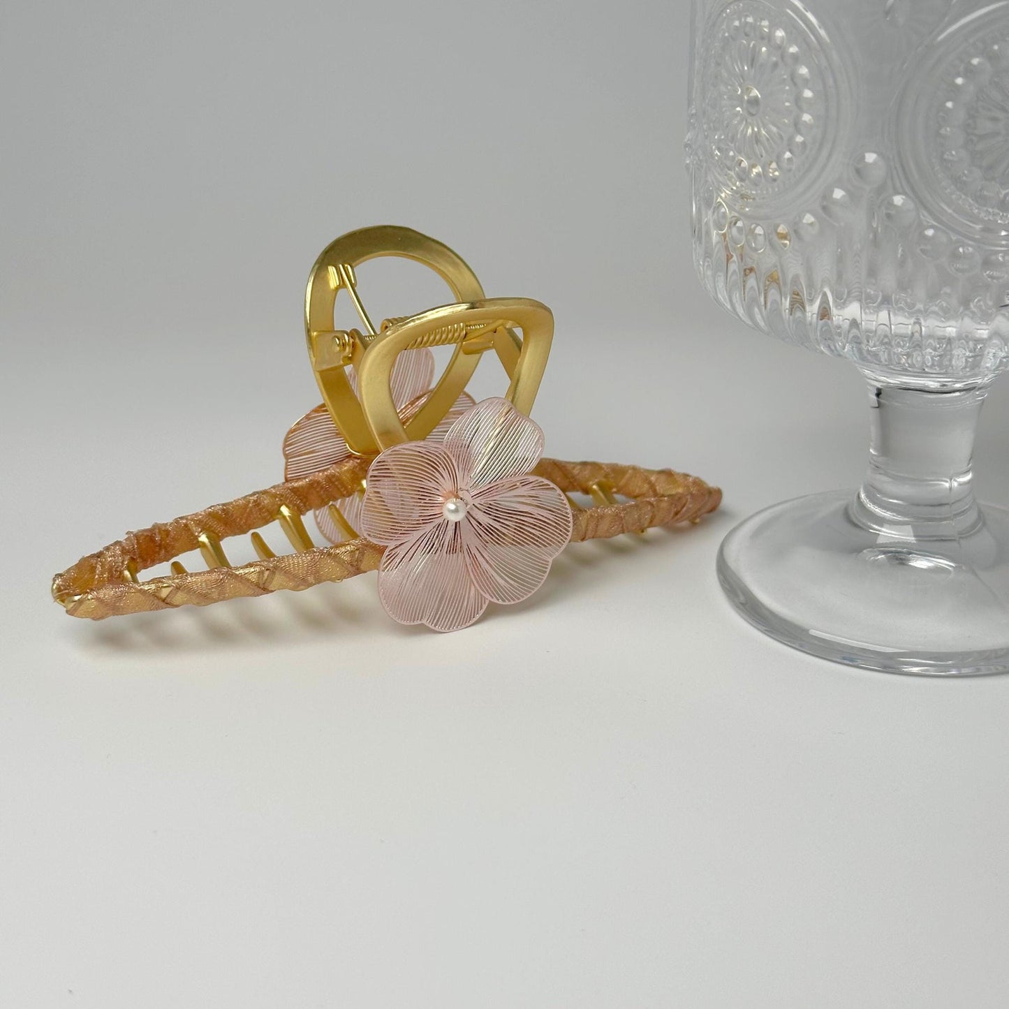 a pair of hair clips sitting on top of a table