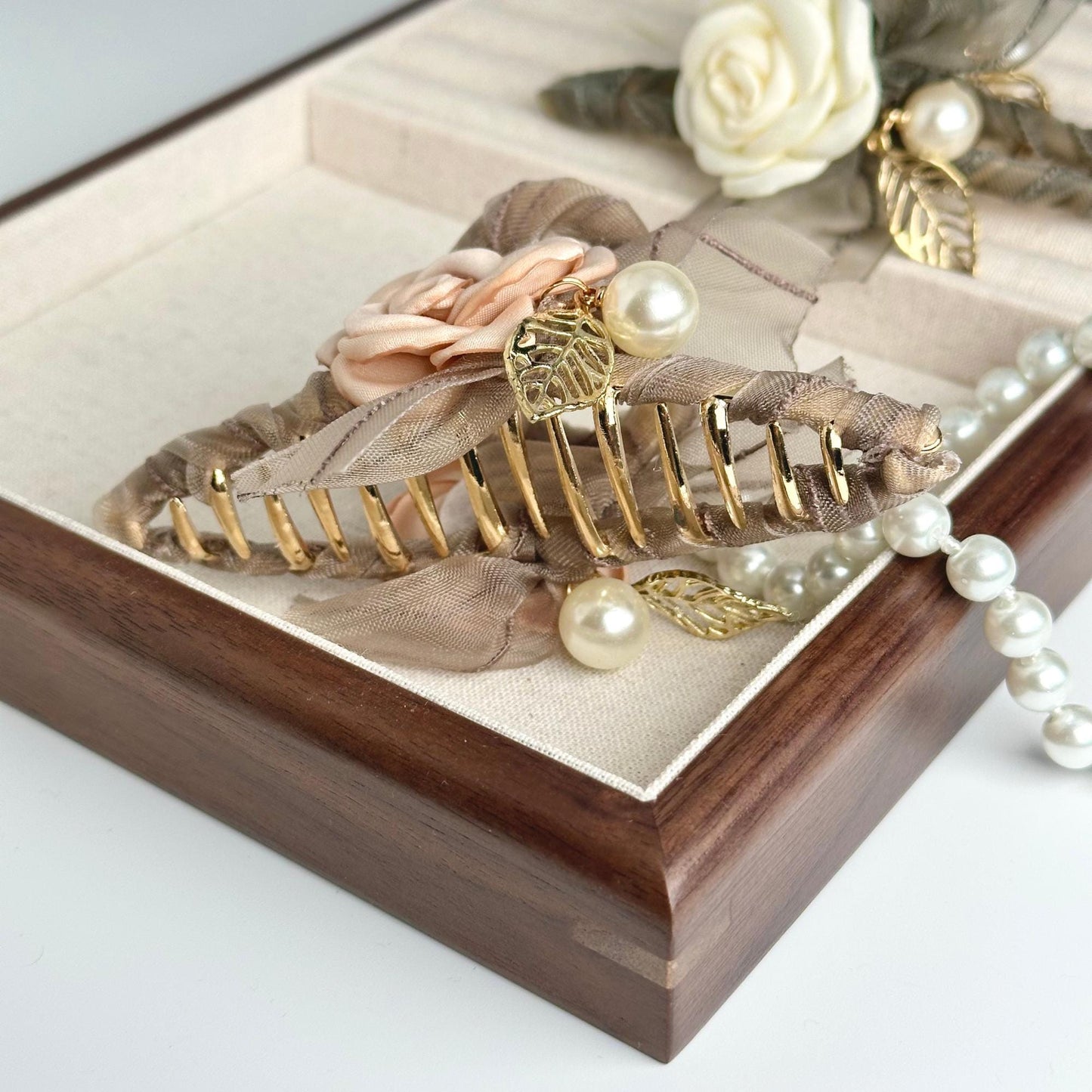 a close up of a jewelry box with flowers