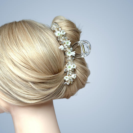 a close up of a woman's head wearing a hair comb