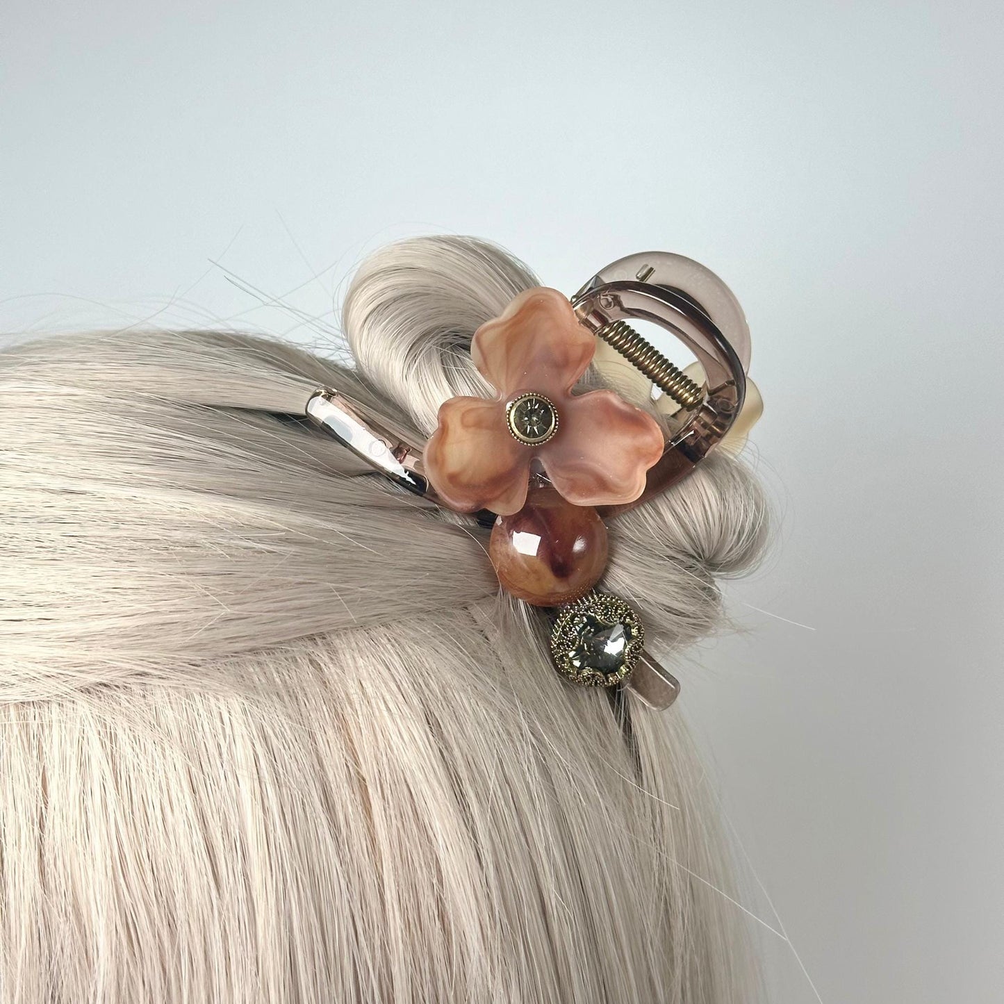 a close up of a woman's hair with a hair clip