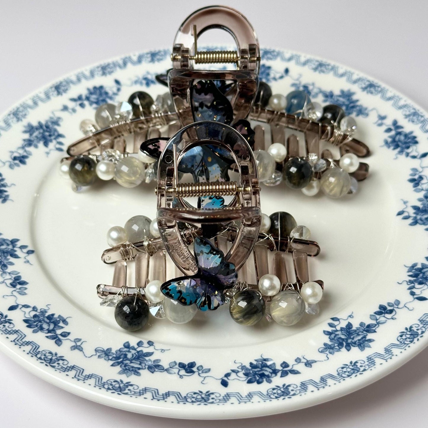 a plate with a bunch of brooches on it
