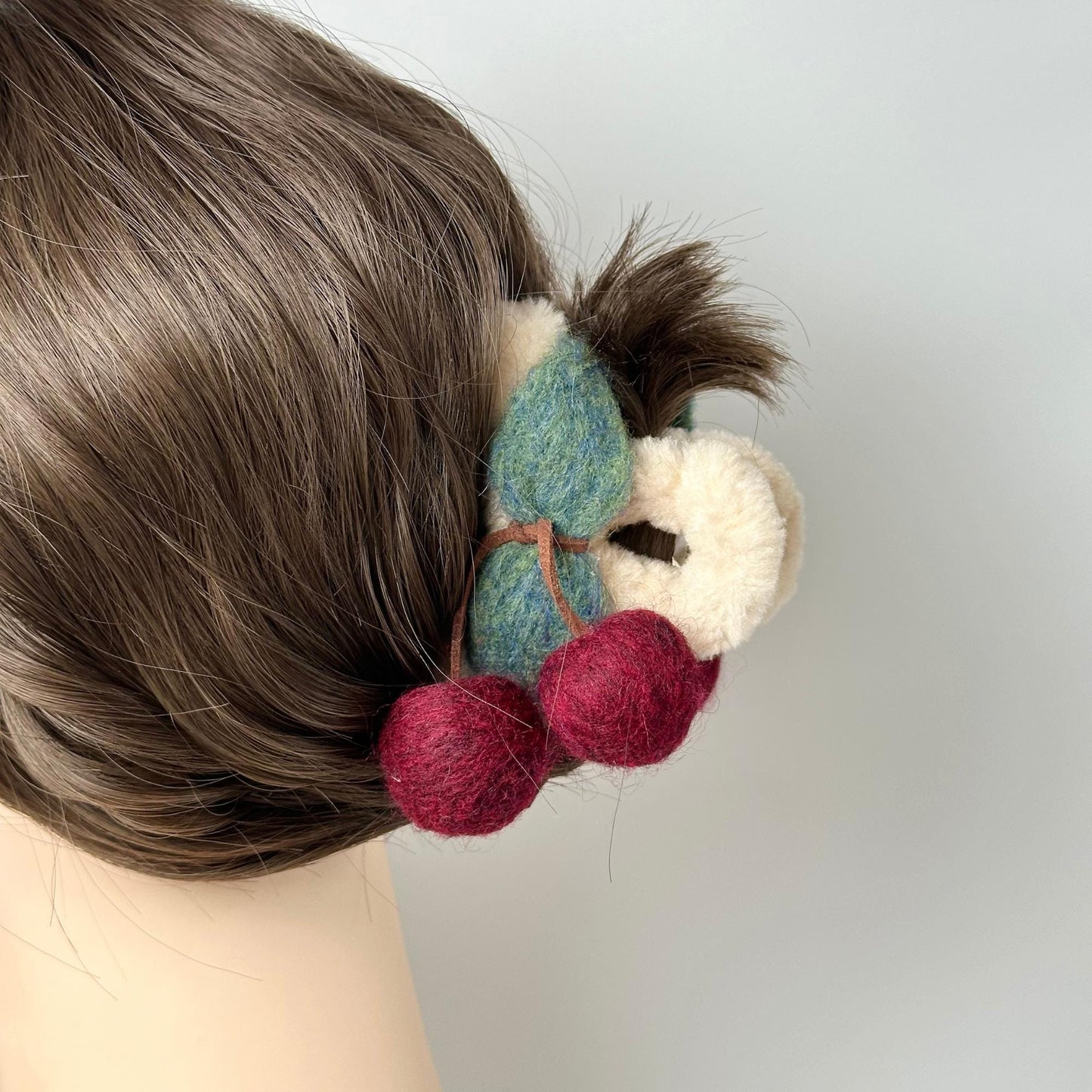 a close up of a person's head with a hair piece in the shape