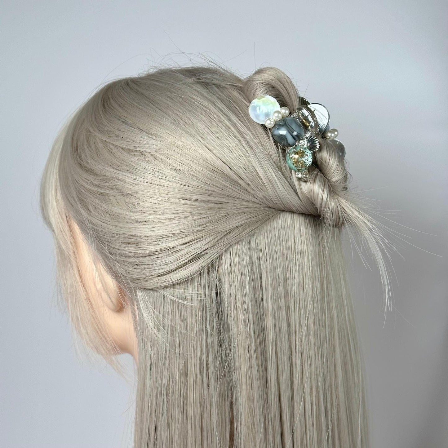 a woman with blonde hair and a flower in her hair