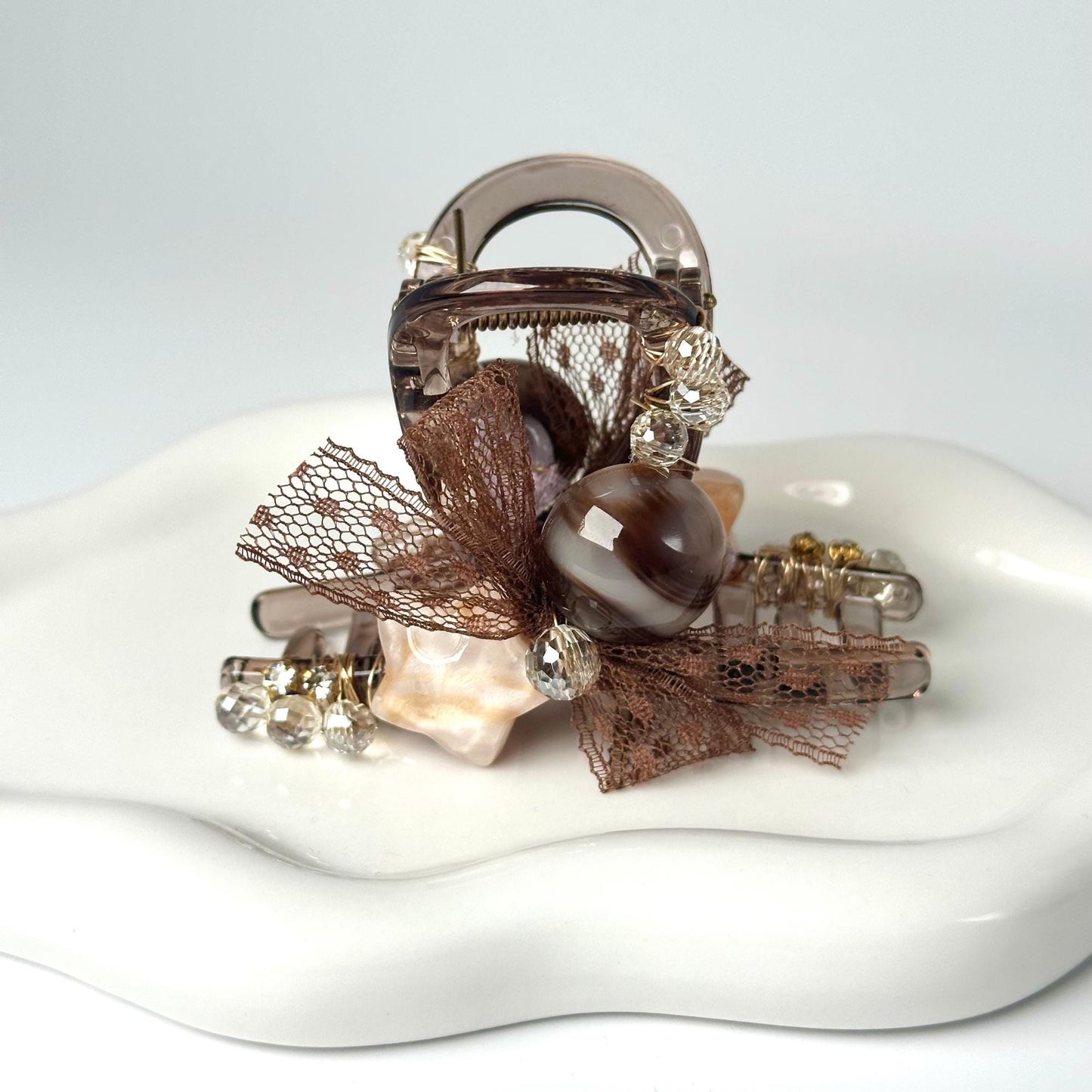 a white platter with a purse on top of it