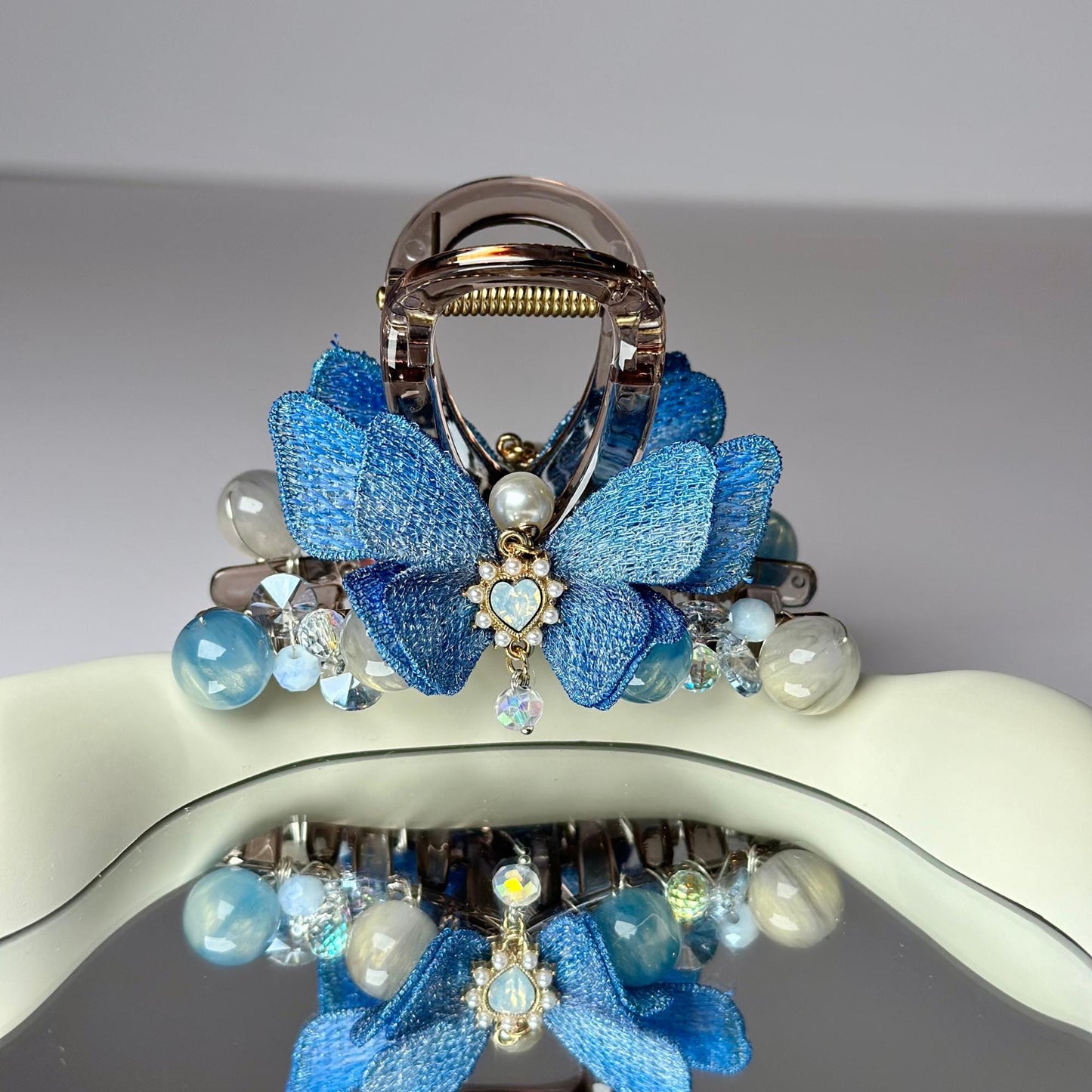 a close up of a purse with a butterfly on it
