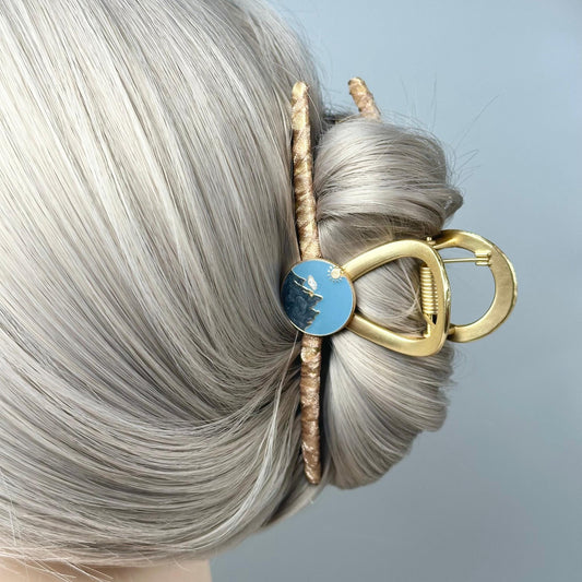 a close up of a woman with a hair clip in her hair