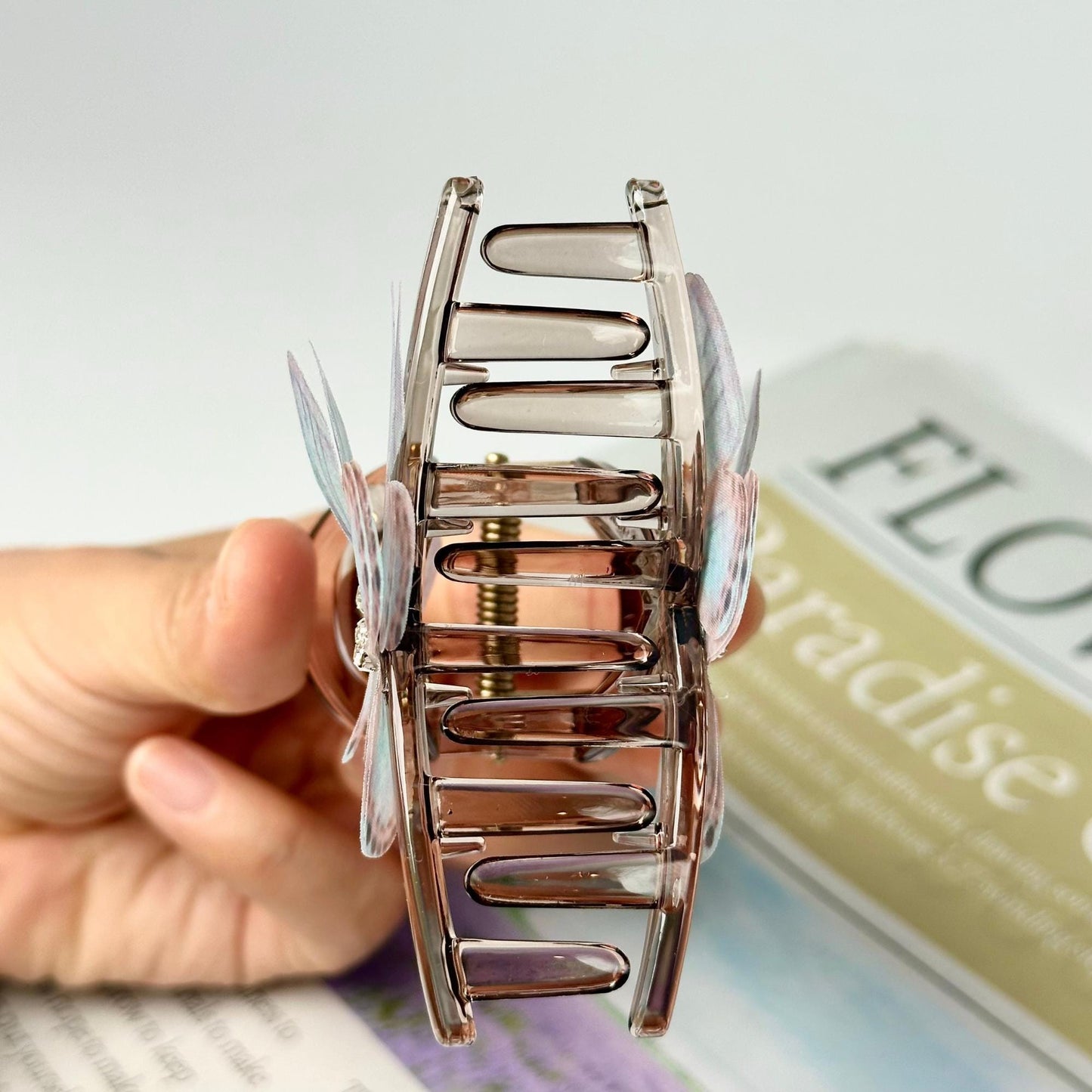 a person holding a small metal object in their hand