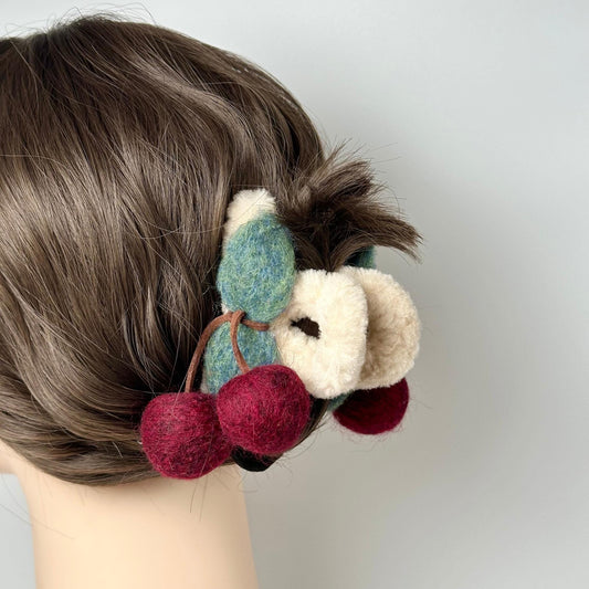 a close up of a person's hair with a stuffed animal in it