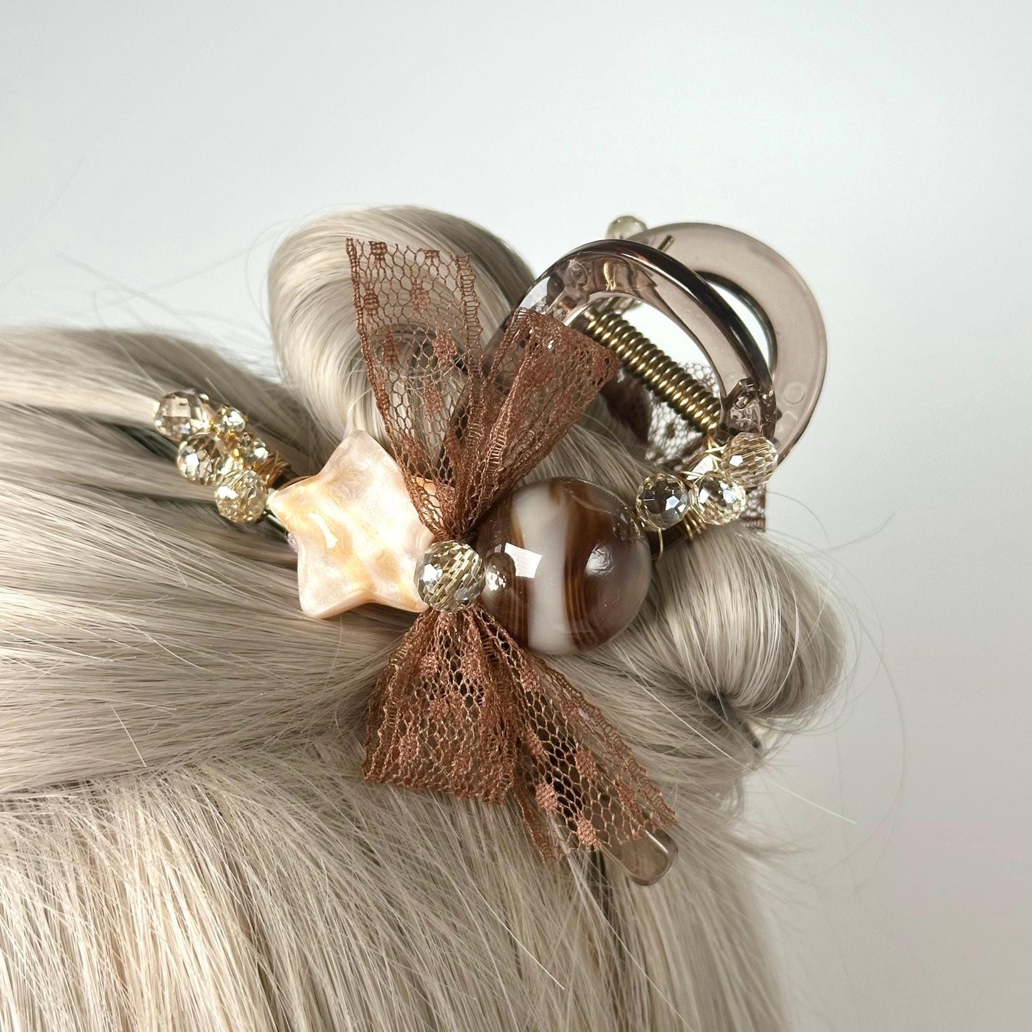 a close up of a woman's hair with hair clips