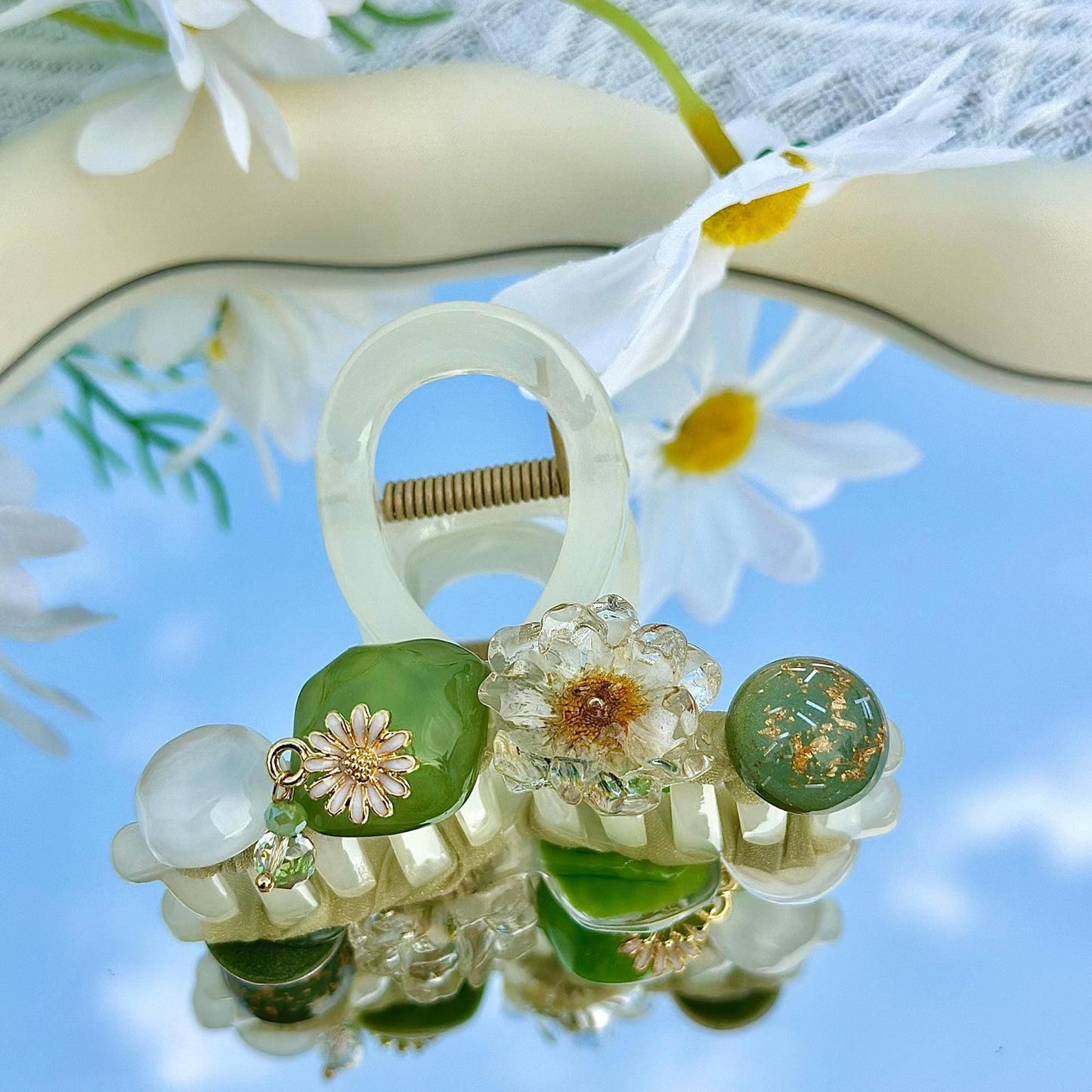 a close up of a flower and a pair of scissors