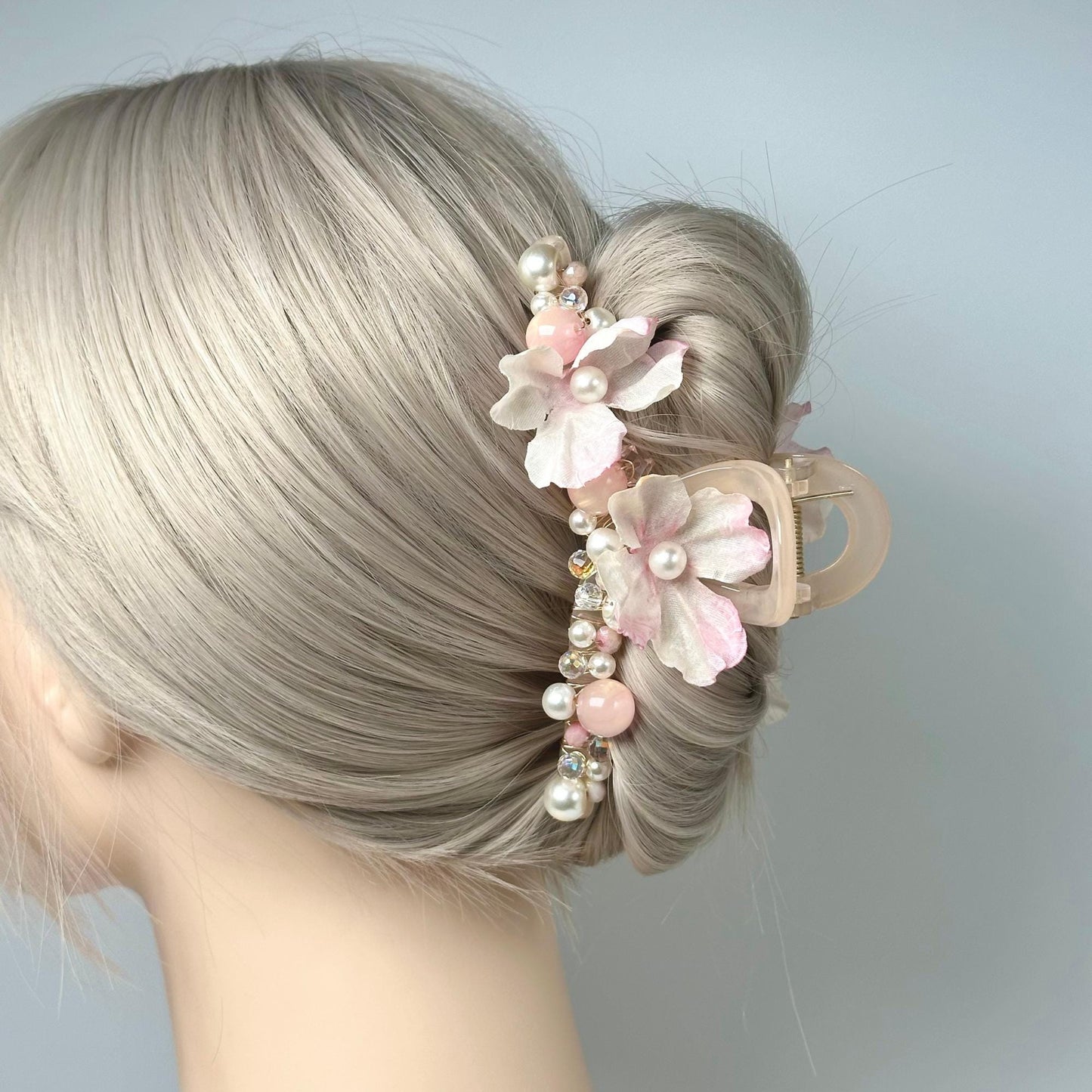 a close up of a woman's hair with flowers in it