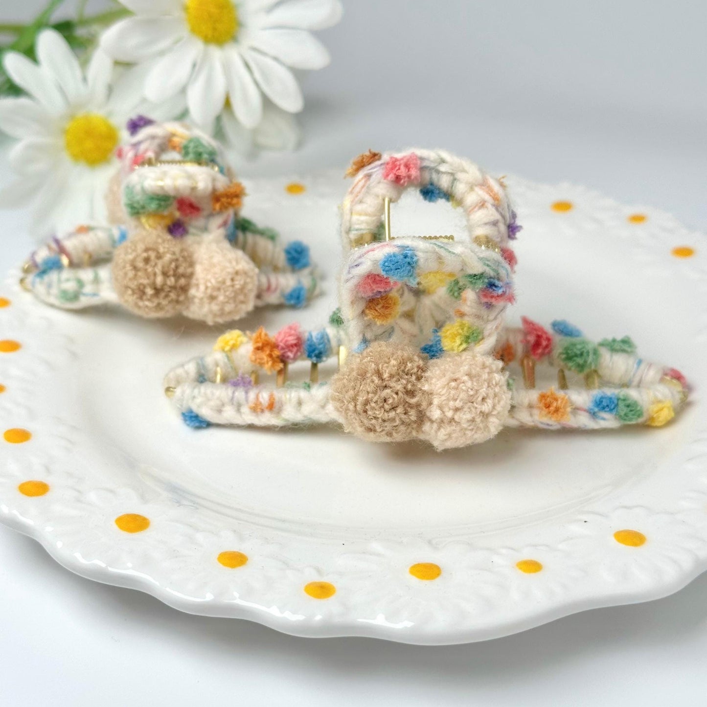a white plate topped with a pair of baby shoes