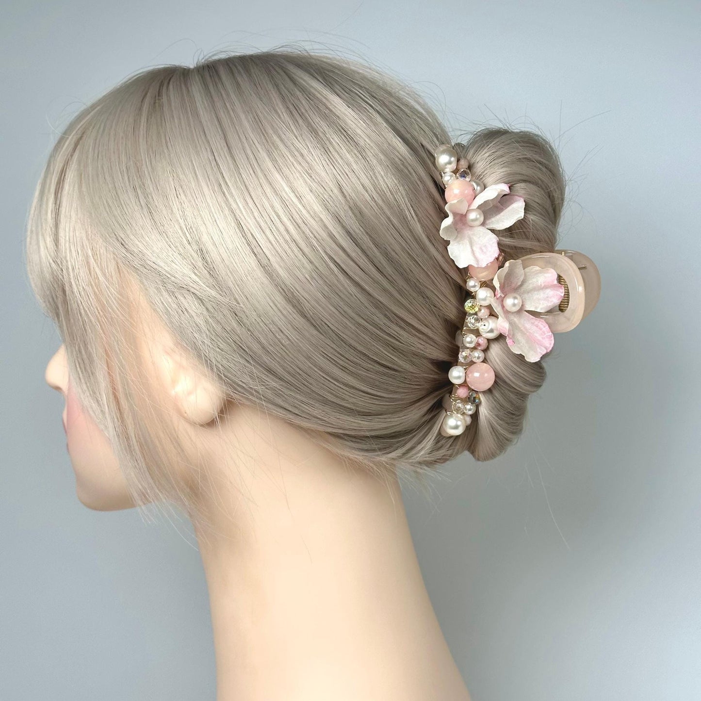 a close up of a woman's head with a hair comb