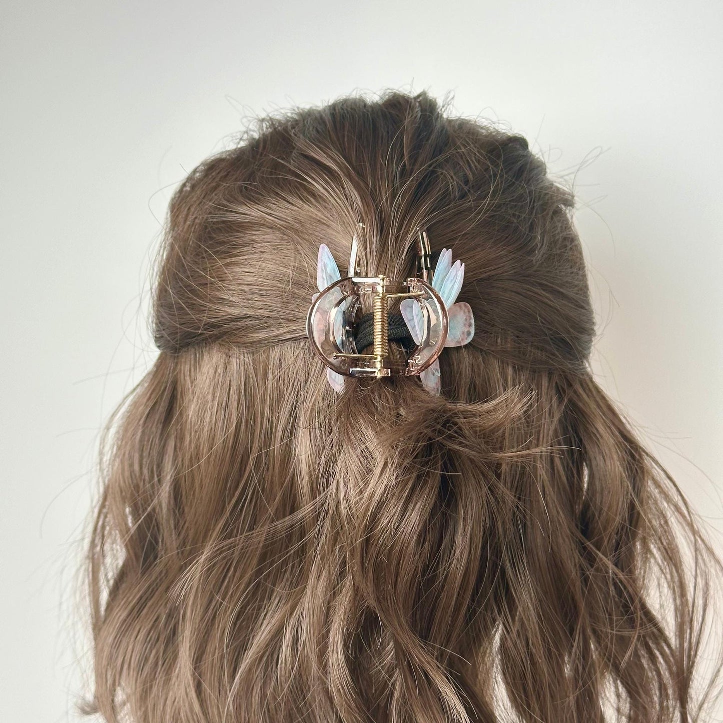 a close up of a person with a hair clip in their hair