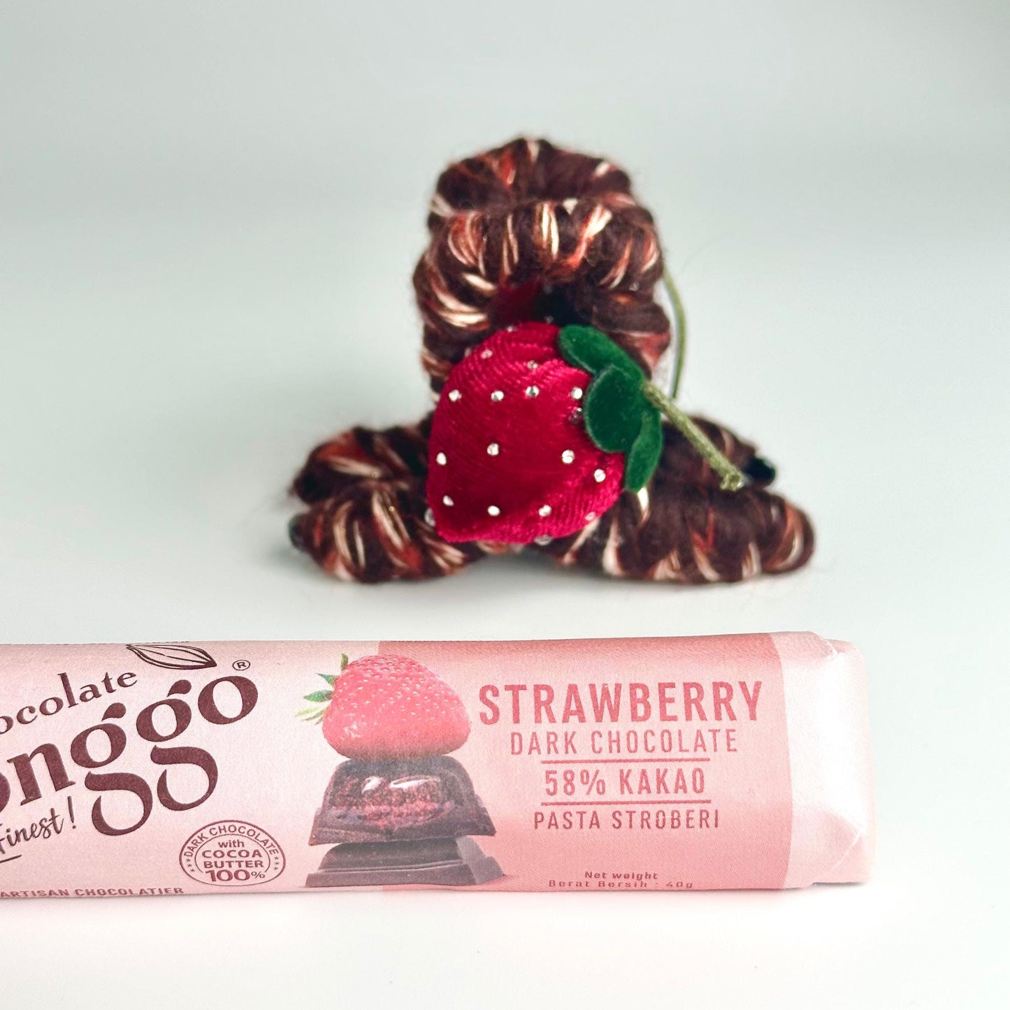 a chocolate bar with a strawberry on top of it