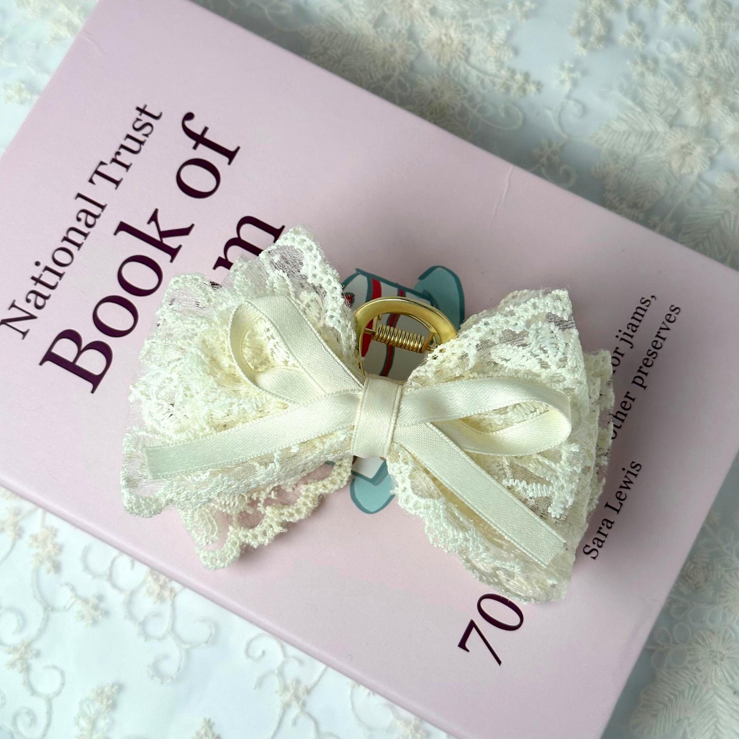 a book with a white bow on top of it