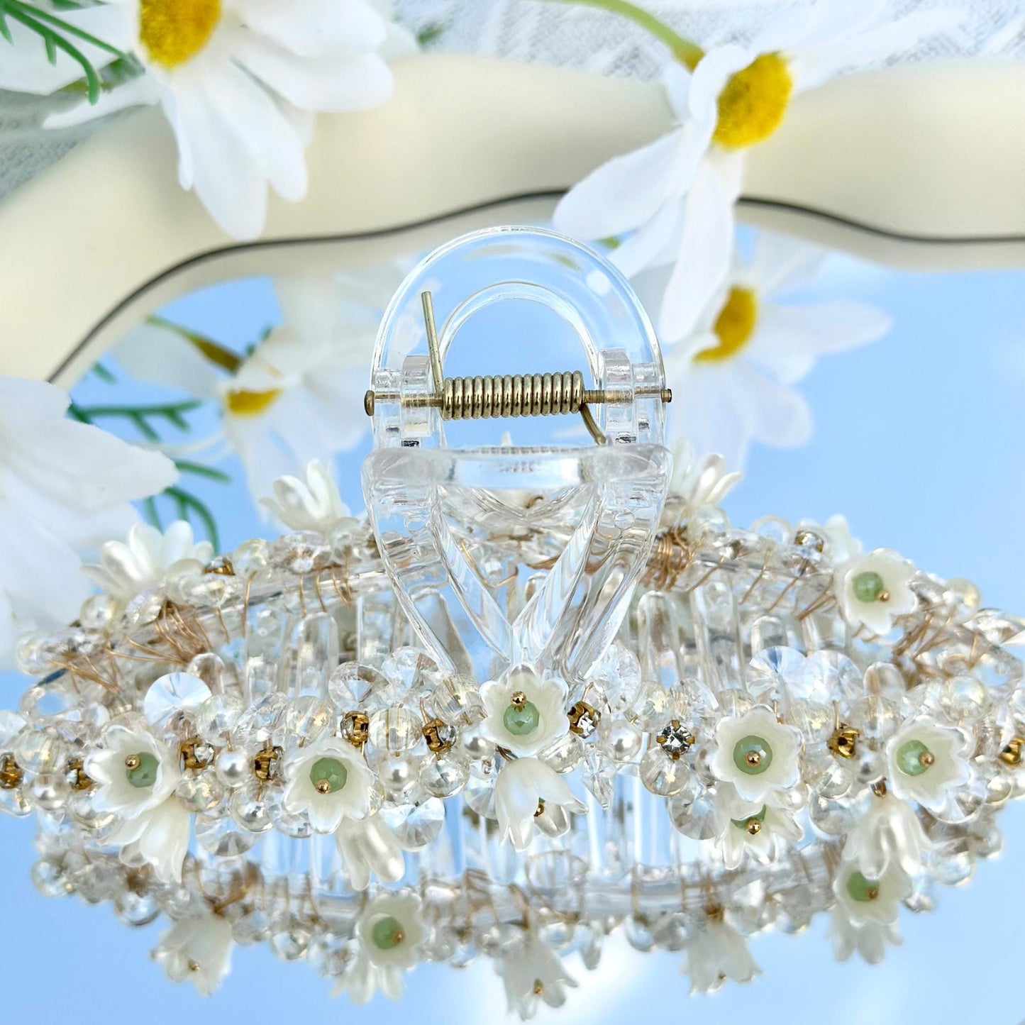 a close up of a chandelier with flowers on it