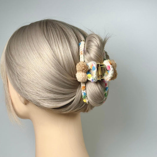 a woman's head with a hair clip in it