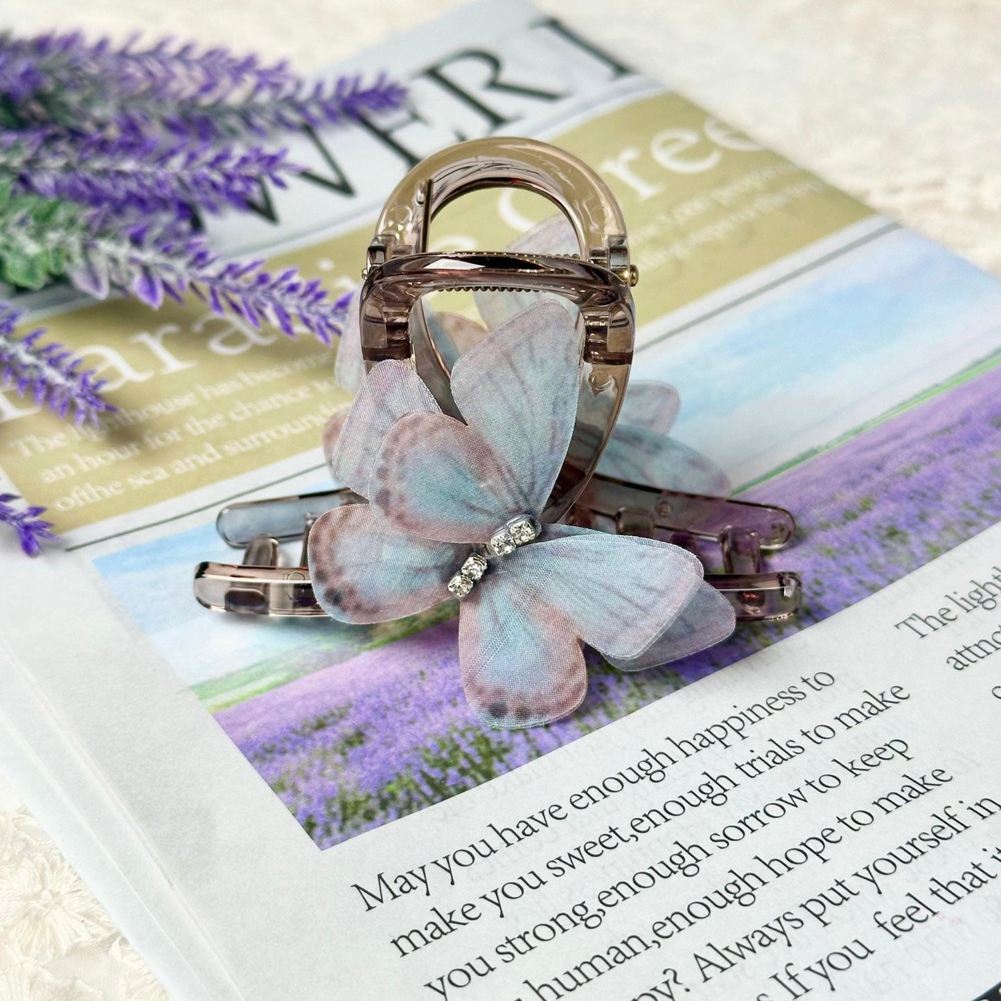 a brooch sitting on top of a magazine