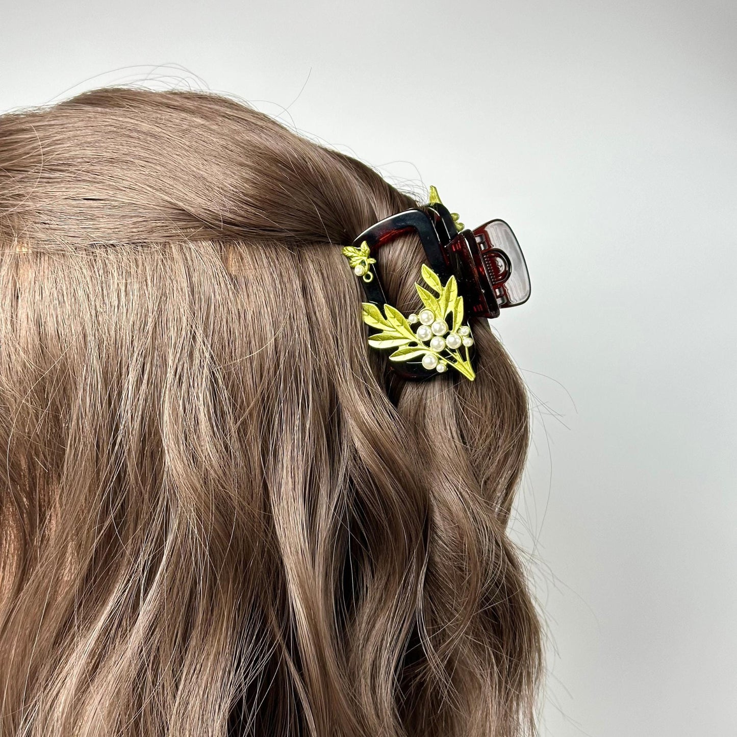 a close up of a woman's hair with a hair clip