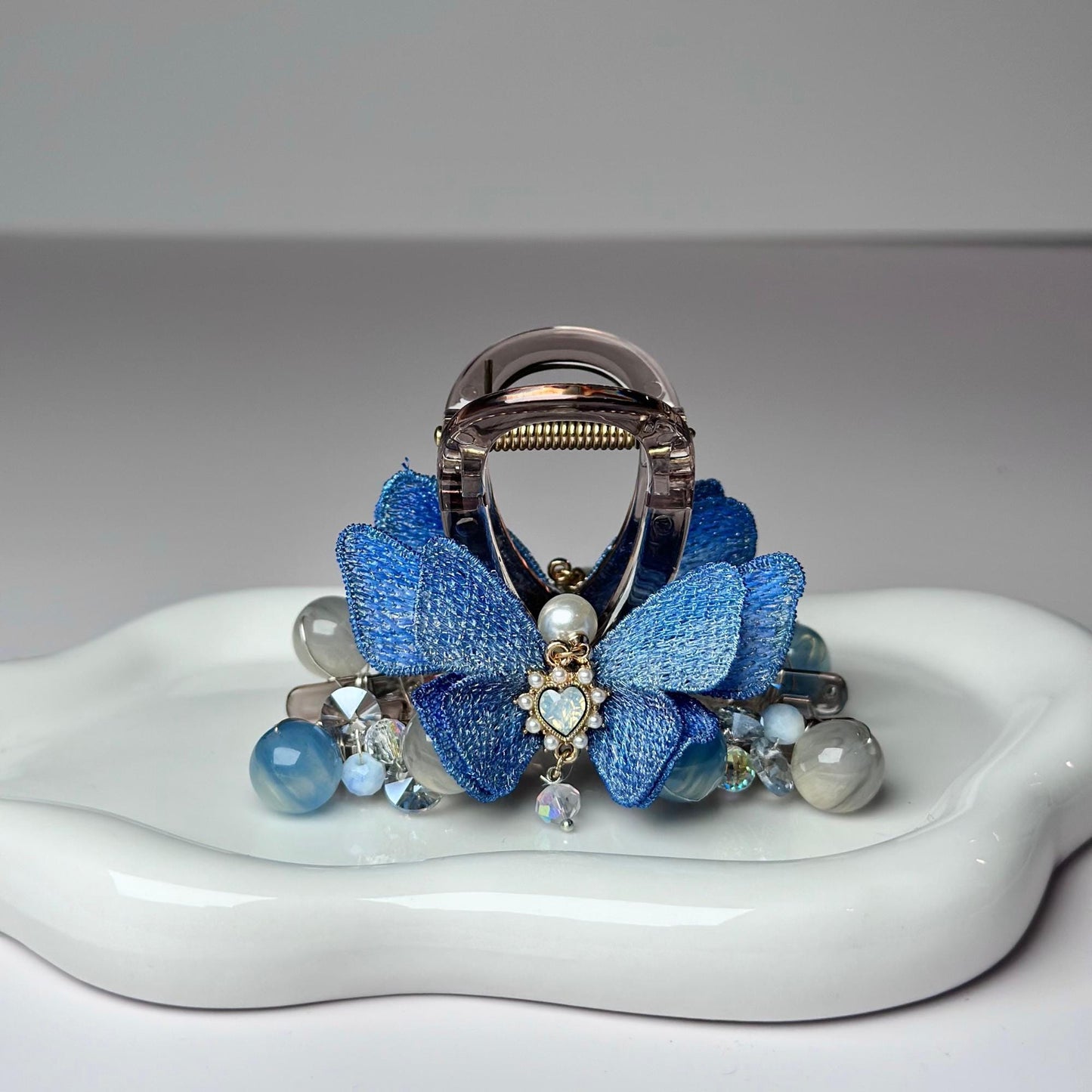 a white plate with a blue flower on it