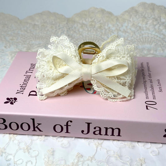 a book with a white bow on top of it