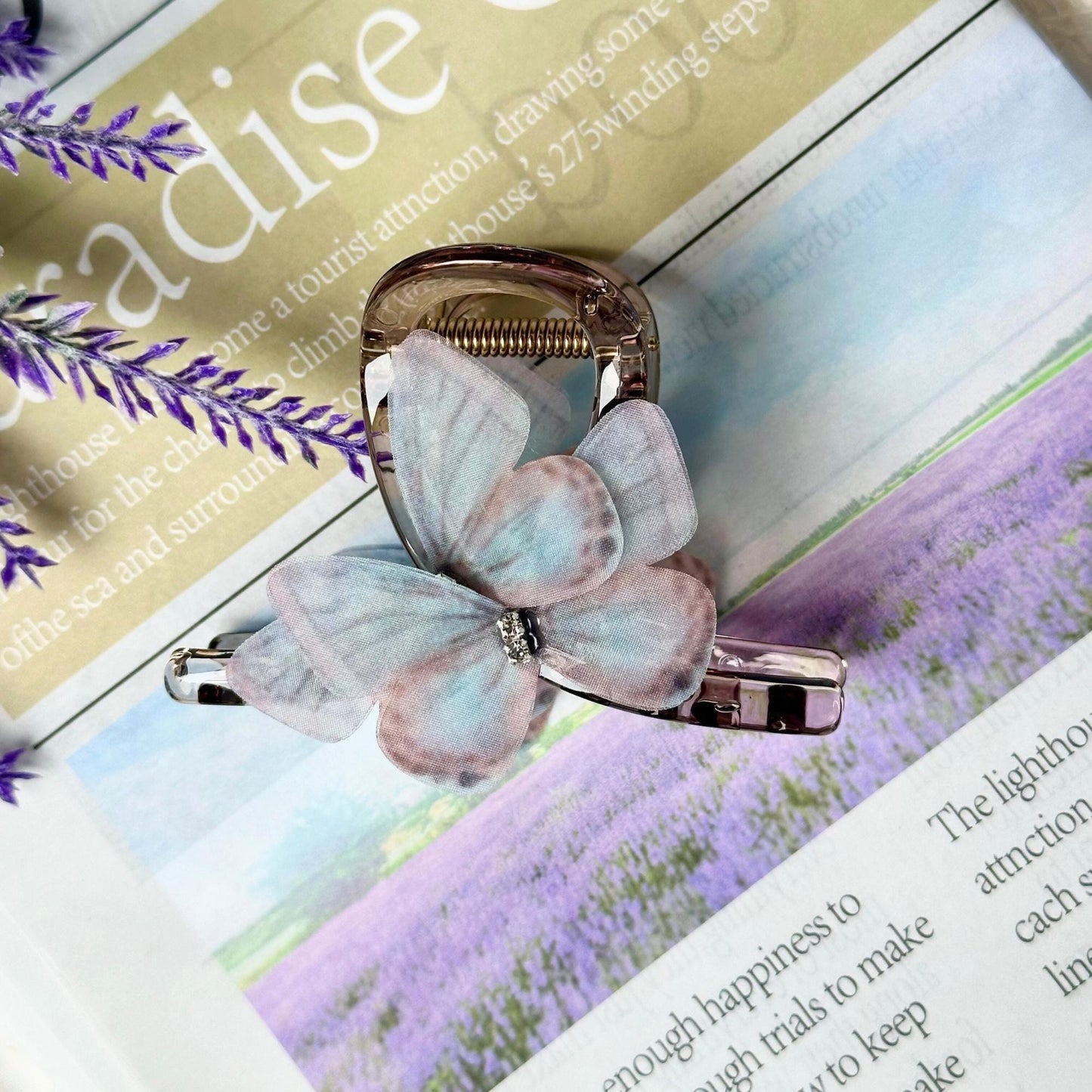 a close up of a book with a butterfly on it