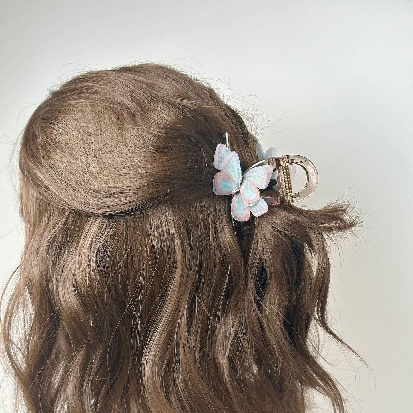a close up of a person's hair with a hair clip