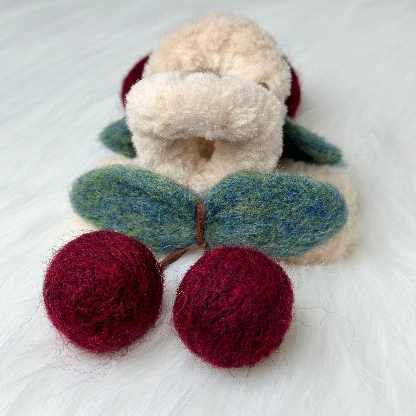 a close up of a stuffed animal on a bed