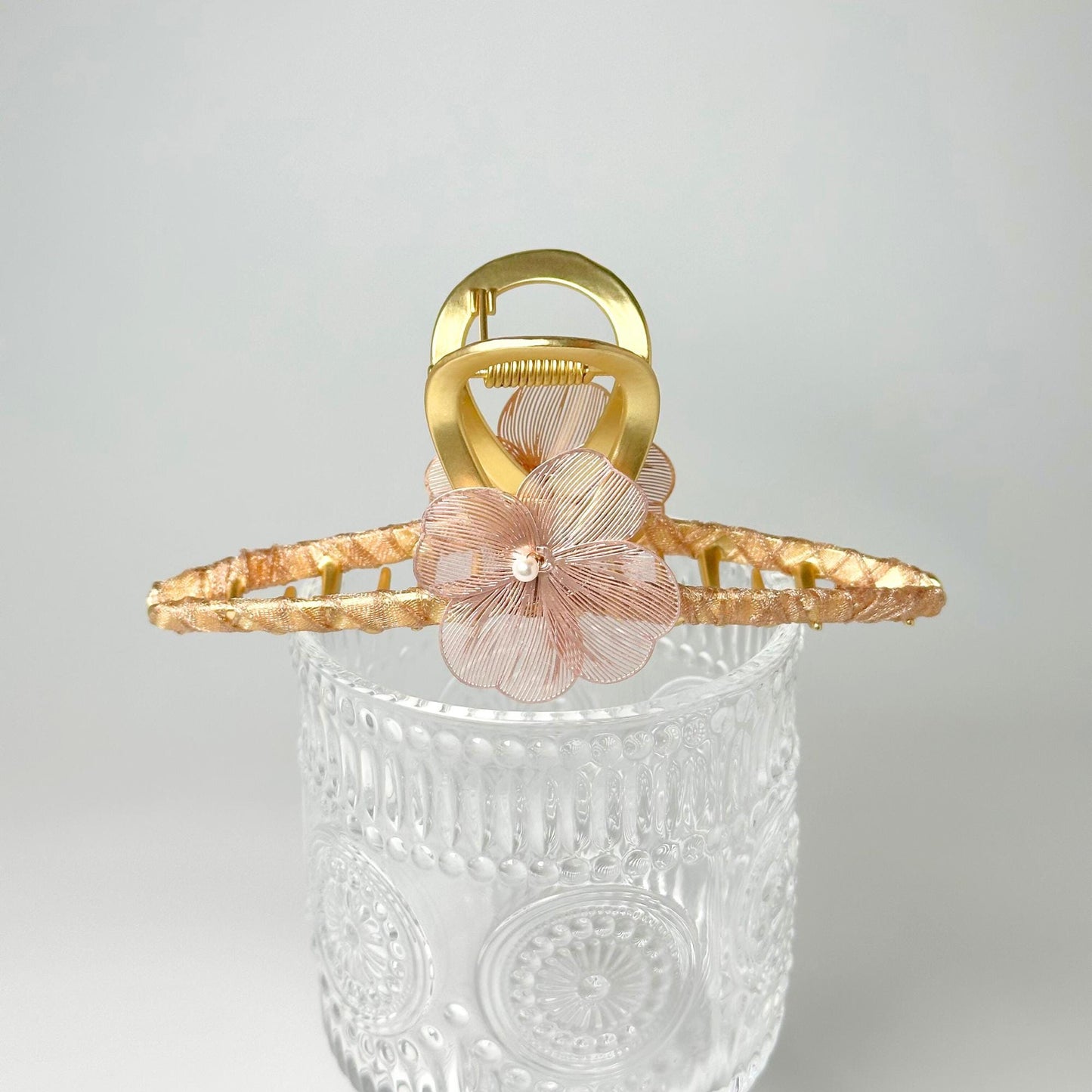 a basket with a flower on top of it