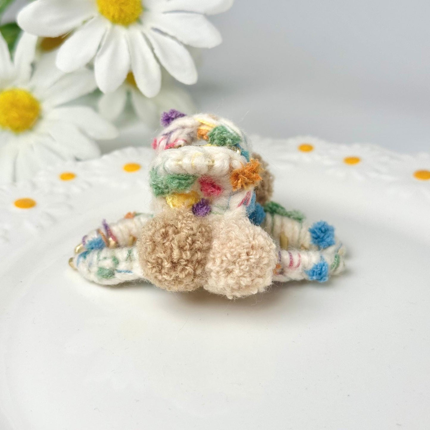 a small stuffed animal sitting on top of a white plate
