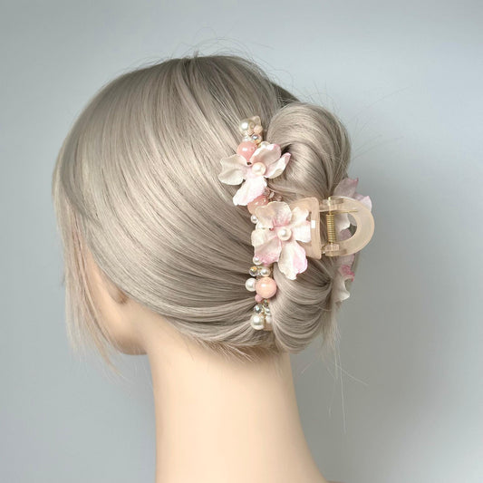 a woman with blonde hair and a flower in her hair