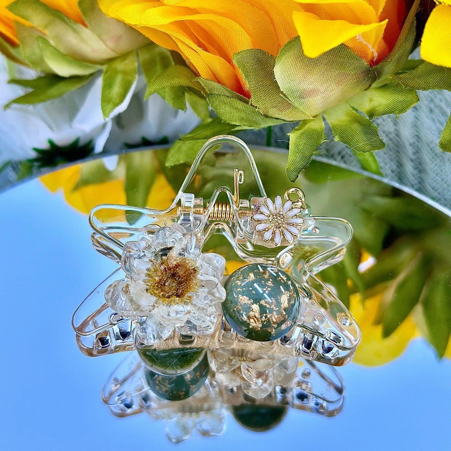 a close up of a vase with flowers in it