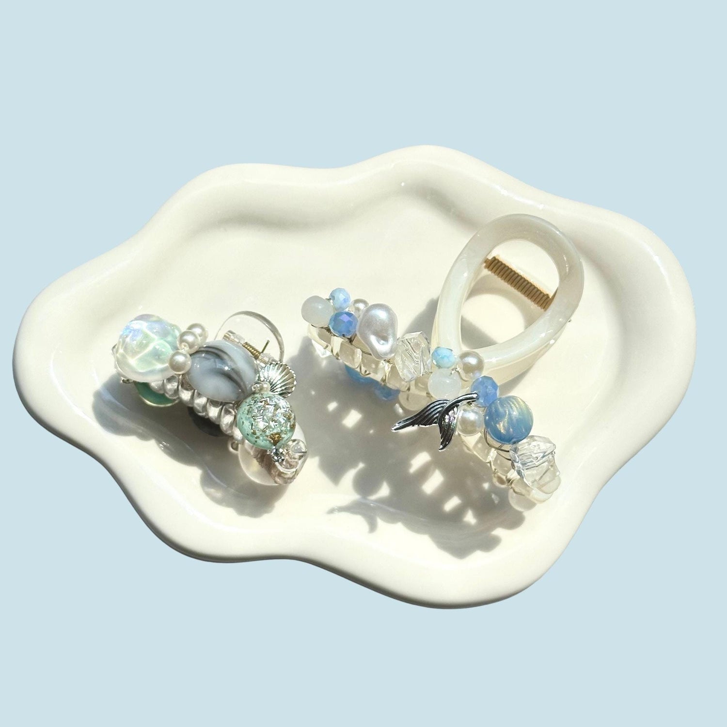a couple of rings sitting on top of a white plate