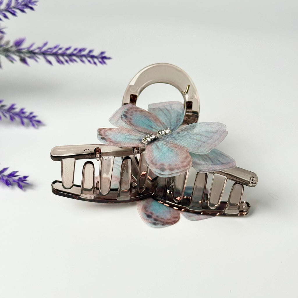 a couple of hair clips sitting on top of a table