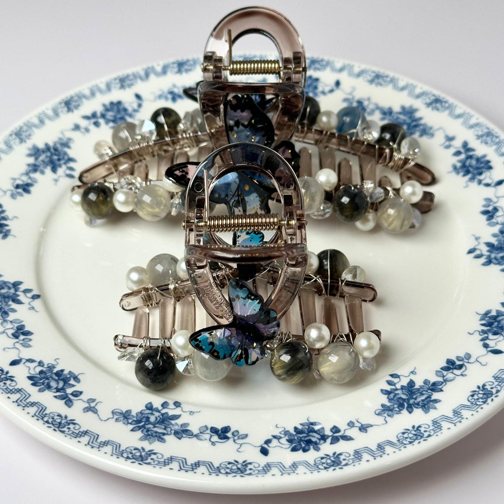 a plate with a bunch of brooches on it