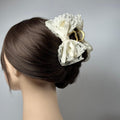 a close up of a woman's head with a hair clip
