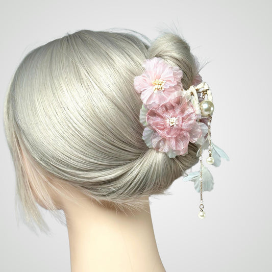a close up of a woman with a flower in her hair