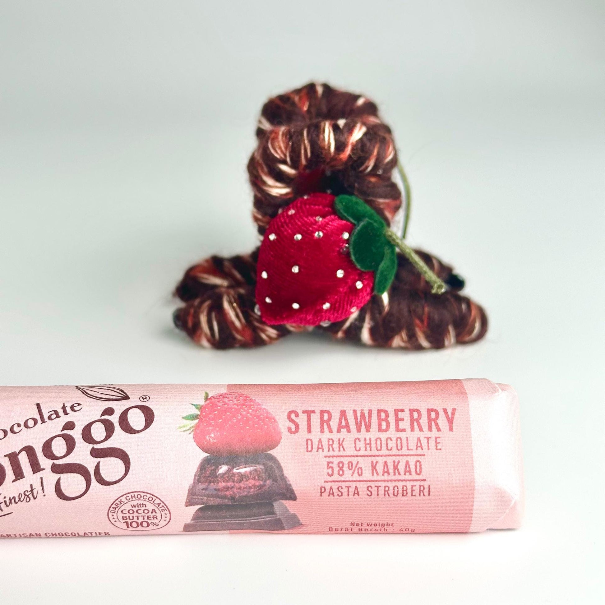 a chocolate bar with a strawberry on top of it