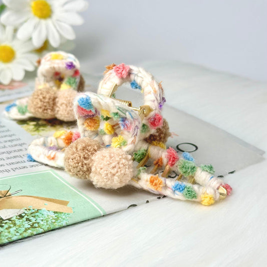a pair of baby shoes sitting on top of a book