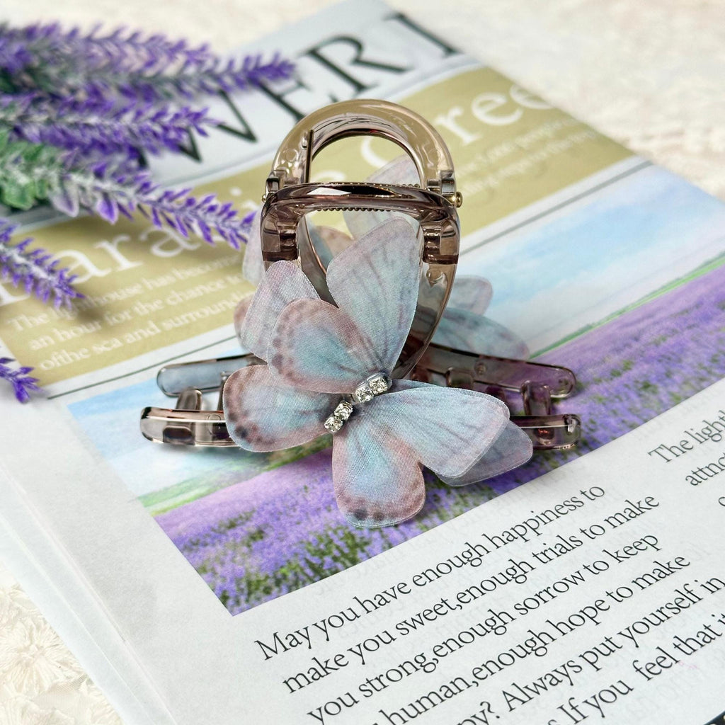 a brooch sitting on top of a magazine