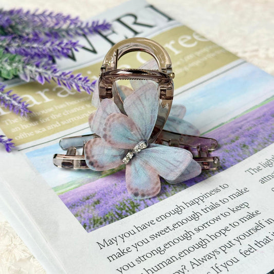 a brooch sitting on top of a magazine