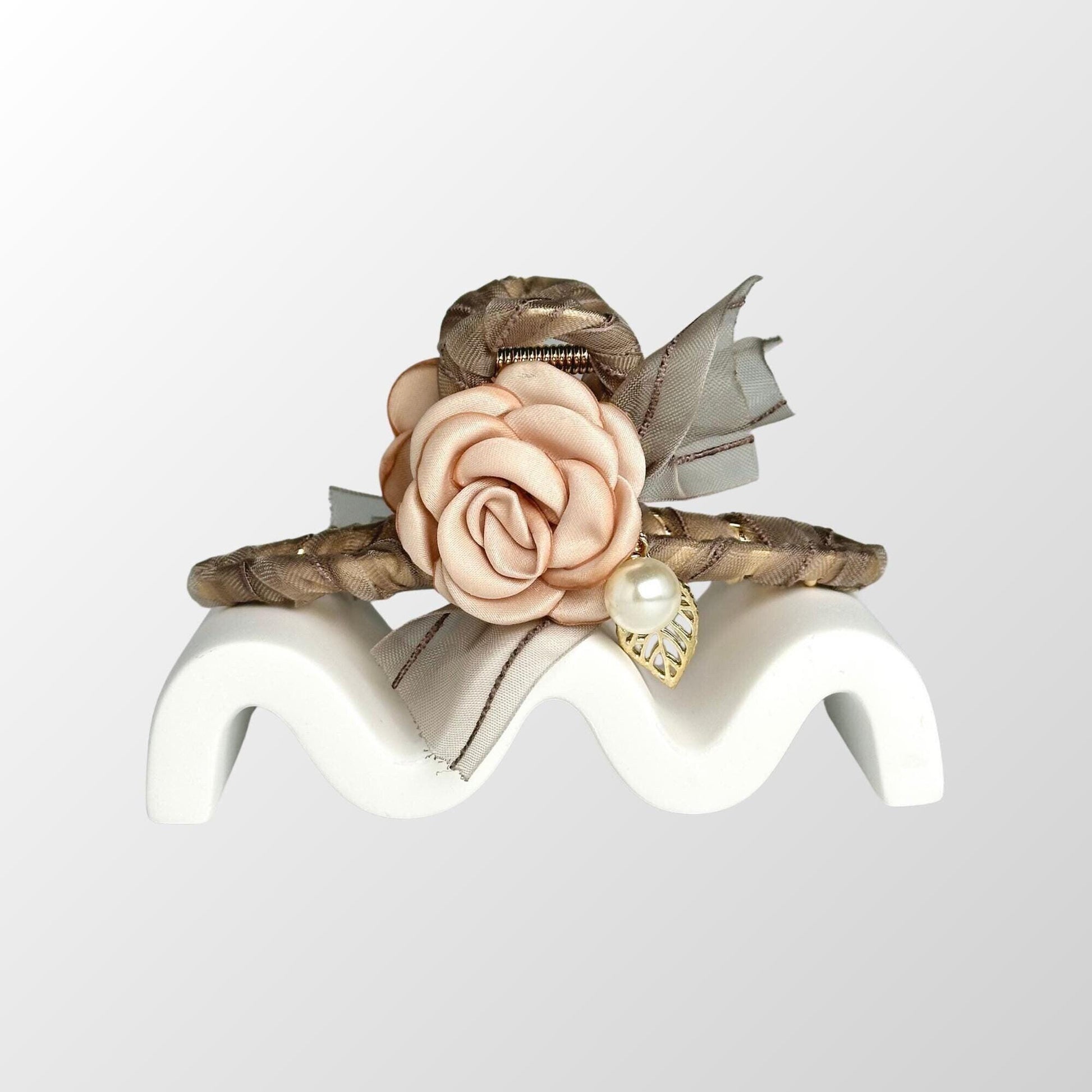 a close up of a ring with a flower on it