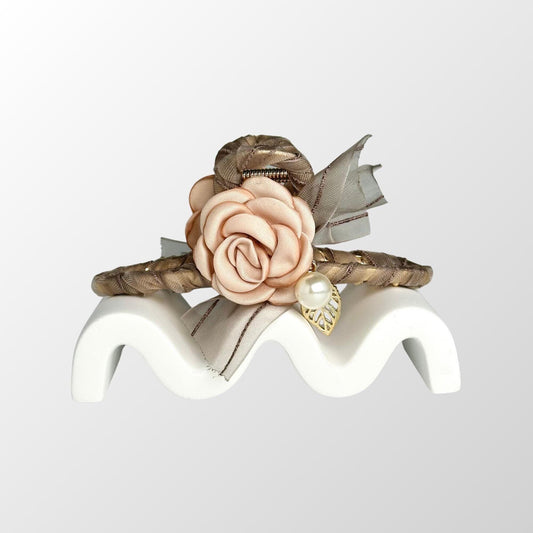 a close up of a ring with a flower on it