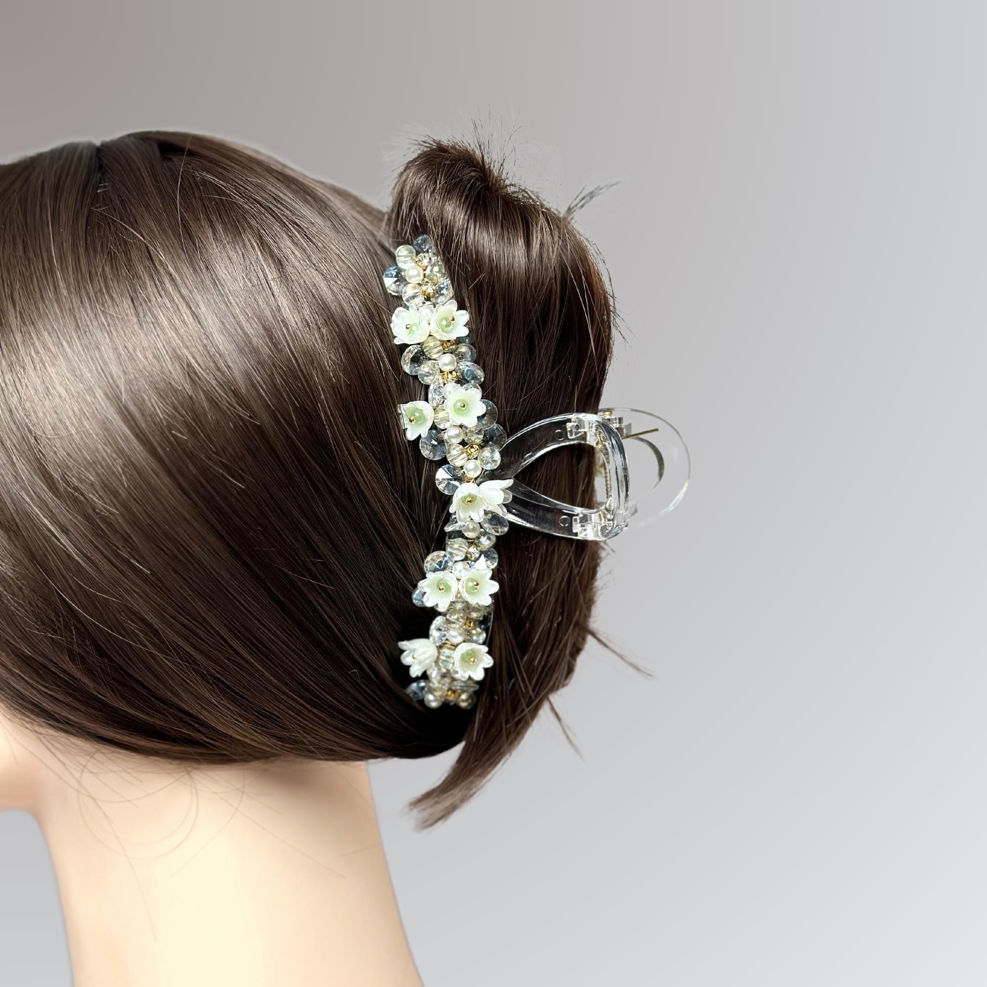 a close up of a woman's head wearing a hair comb