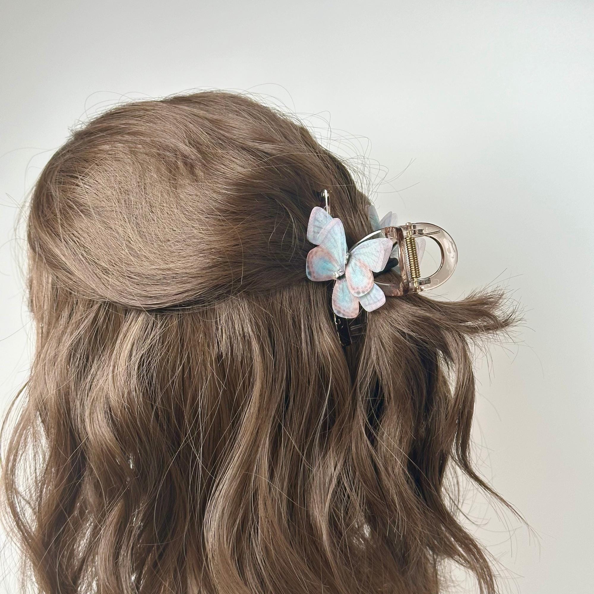 a close up of a person's hair with a hair clip