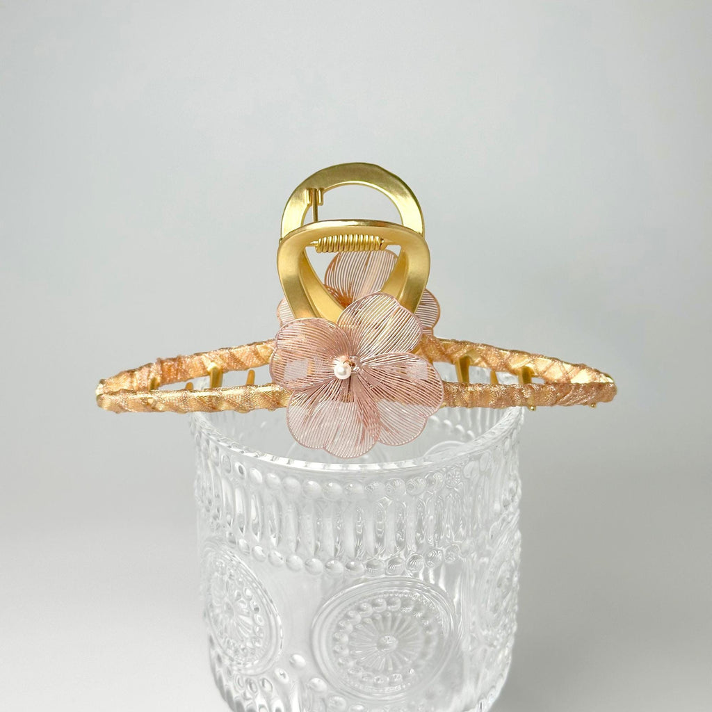 a basket with a flower on top of it