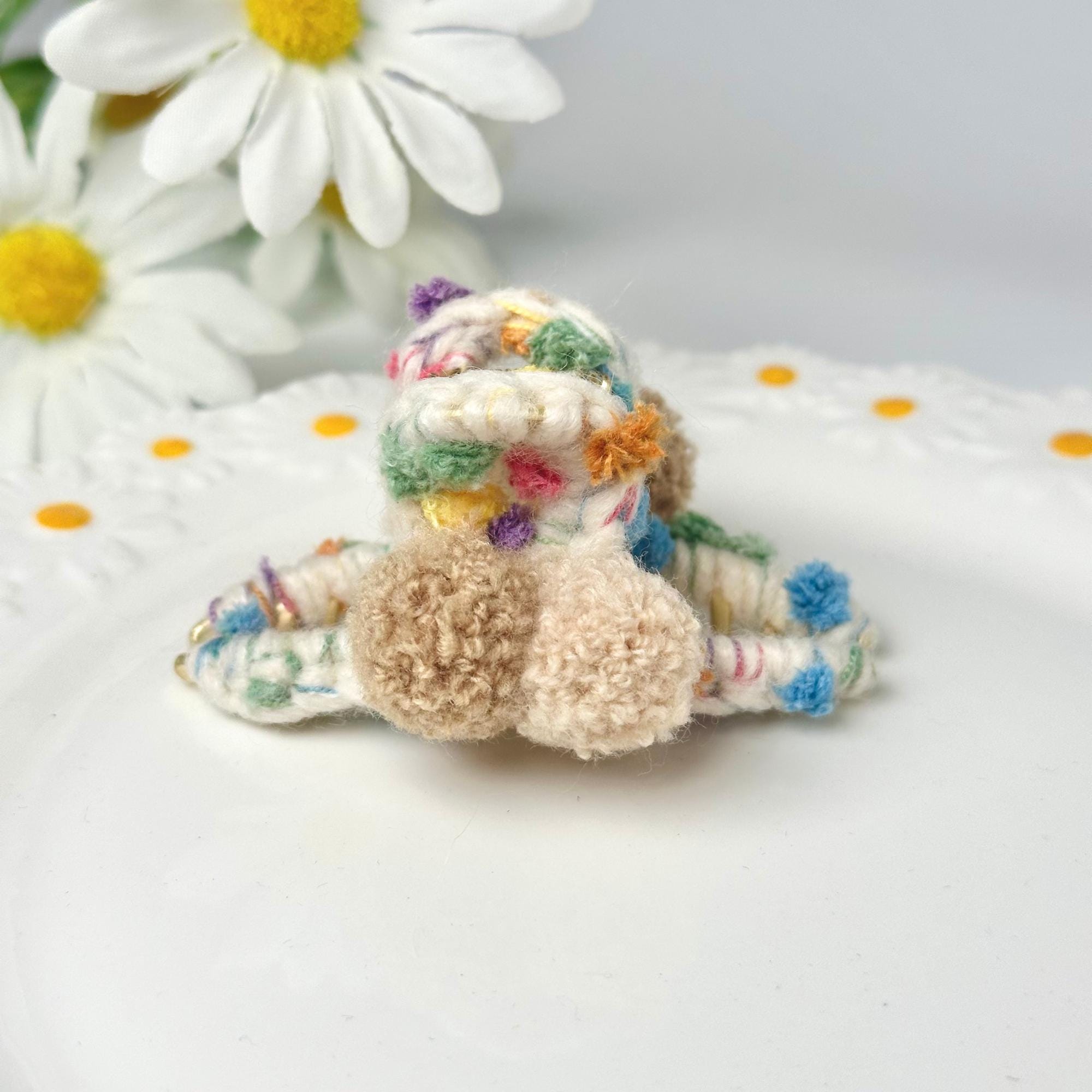 a small stuffed animal sitting on top of a white plate
