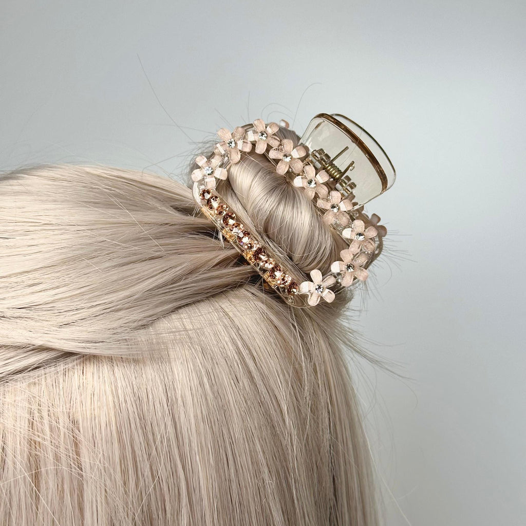 a woman with blonde hair wearing a hair clip